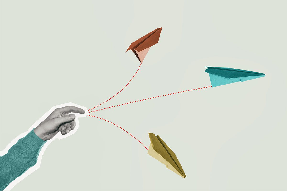 Illustration of a hand throwing multiple paper airplanes