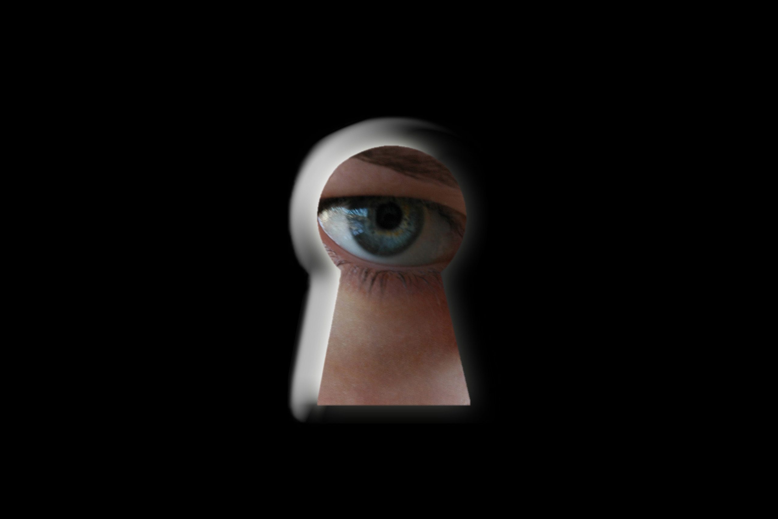 Eye peeping through keyhole